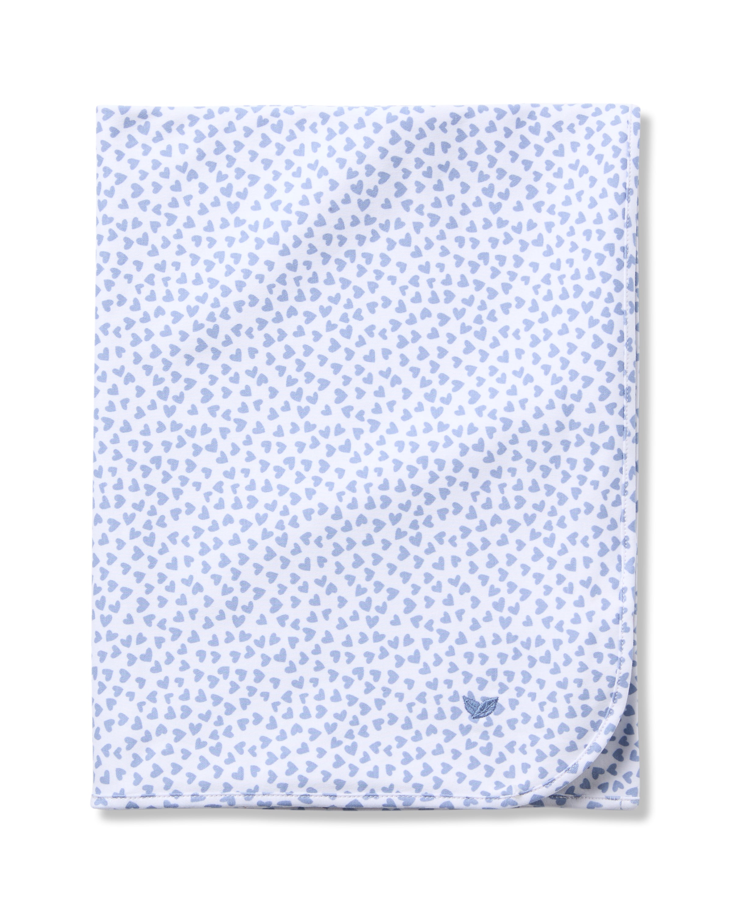 The Pima Baby Blanket in Bluehearts by Petite Plume is crafted from luxurious Pima Cotton with light blue heart patterns on a white background and features a small embroidered logo, delivering ultimate comfort for your baby.