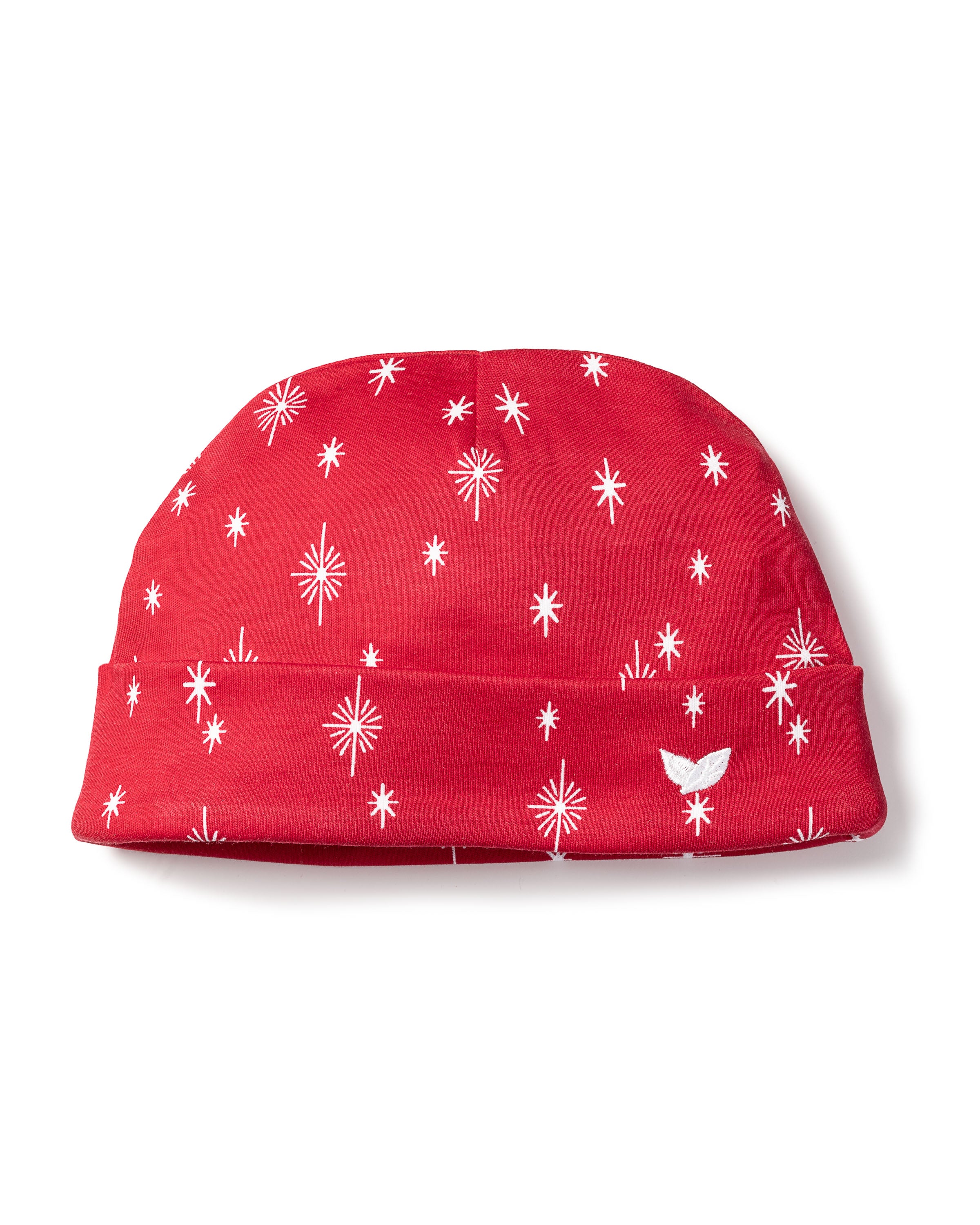 The Babys Pima Hat in Starry Night by Petite Plume is a red beanie with festive white stars and snowflakes, ideal for a babys outfit. Featuring a small side logo, its crafted from ultra-soft Peruvian Pima Cotton, providing comfort with its folded edge and smooth texture.