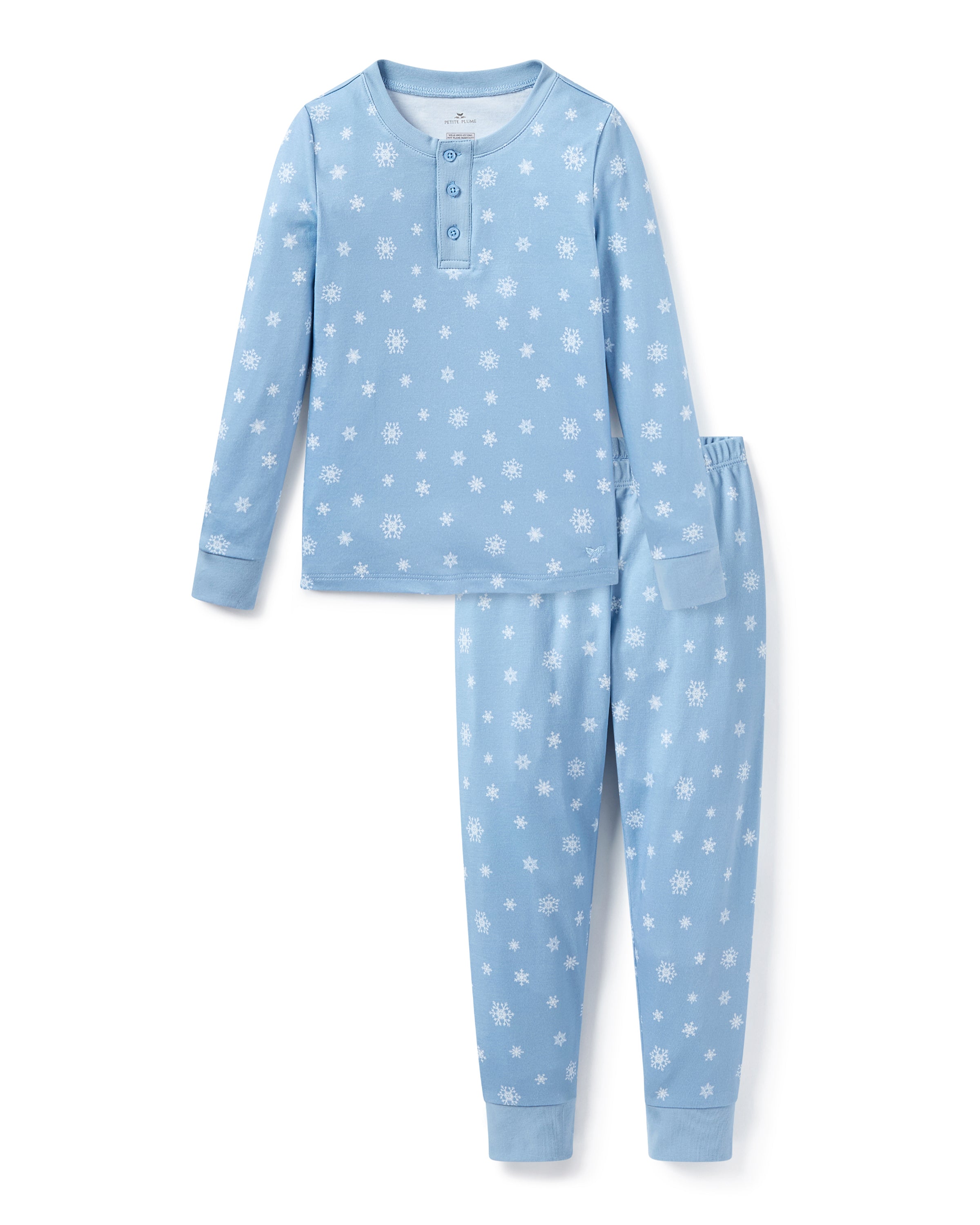 The Kid's Pima Snug Fit Pajama Set in Periwinkle Wonderland features light blue, long-sleeve pajamas with white snowflakes, buttoned neckline, matching elastic waist pants, and cuffed ankles. Shown laid flat on a white background.