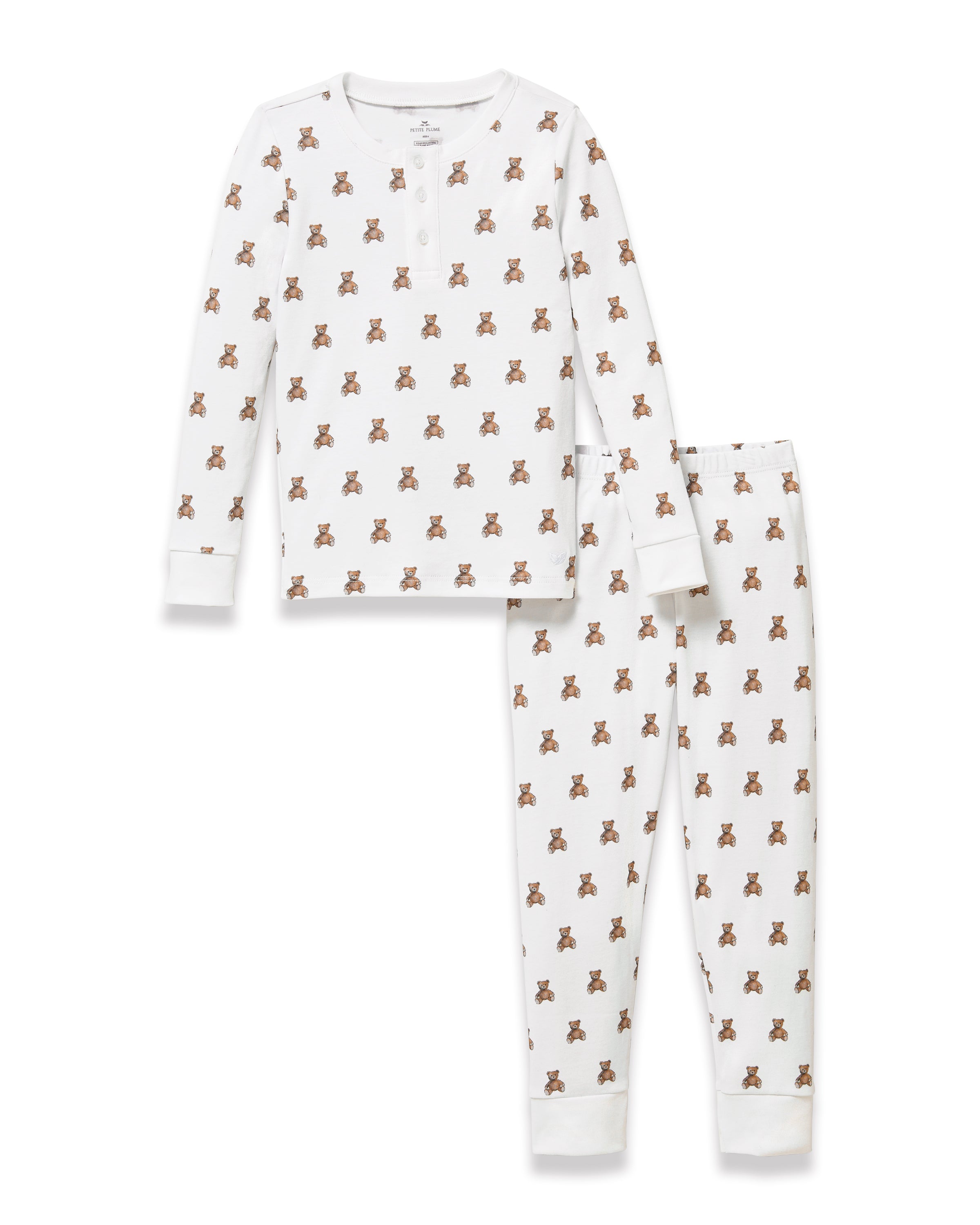 The Kid's Pima Snug Fit Pajama Set in Teddy Tales features a white long-sleeve buttoned top and elastic waist pants with ribbed cuffs, both printed all over with brown teddy bears. Suitable for children.