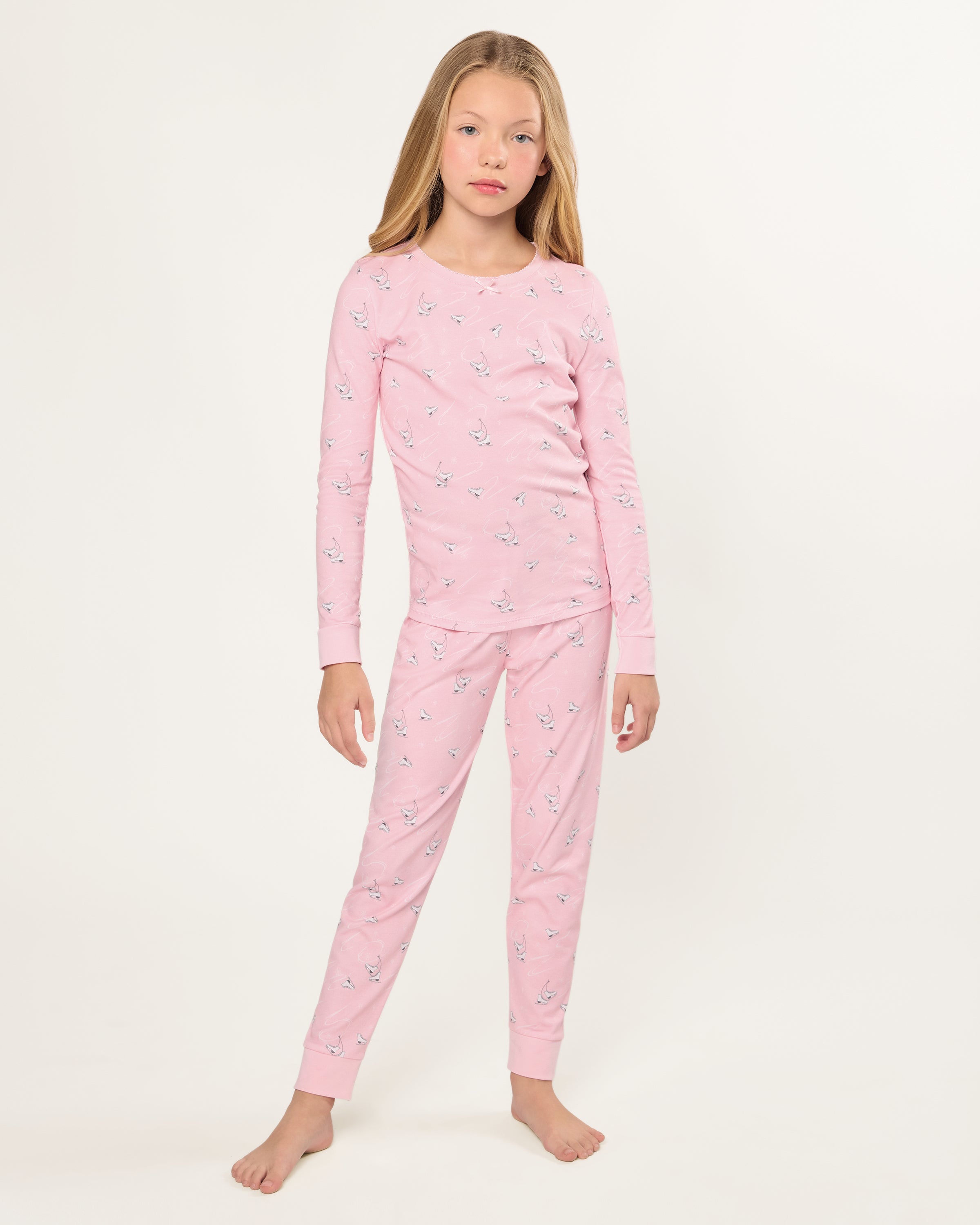 The Kid's Pima Snug Fit Pajama in Winter Skates features a long-sleeved top and pants, displayed flat on a white background.