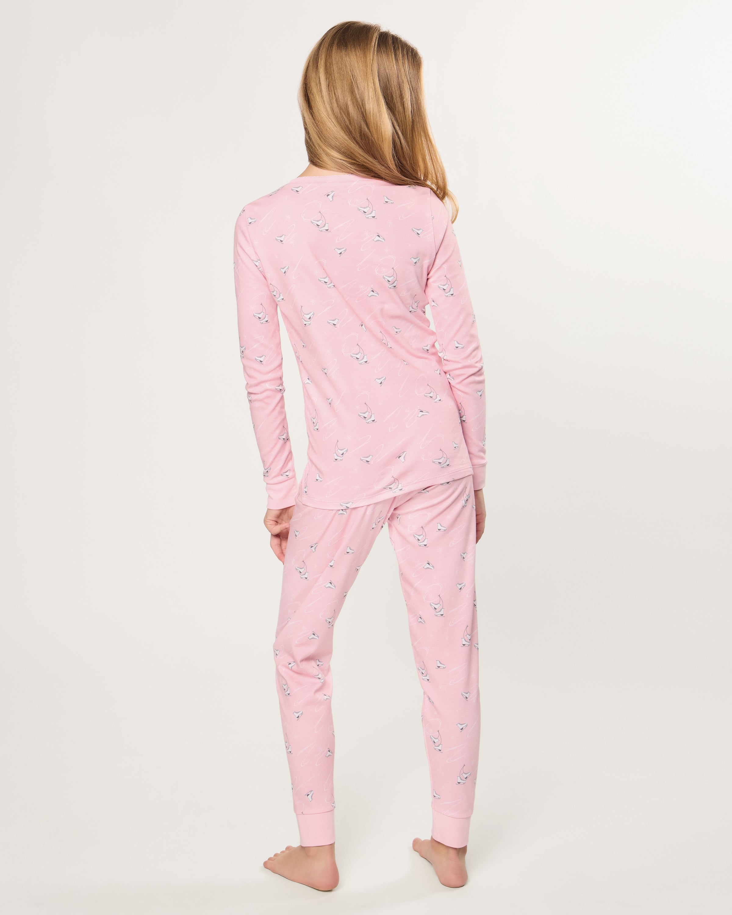 The Kid's Pima Snug Fit Pajama in Winter Skates features a long-sleeved top and pants, displayed flat on a white background.