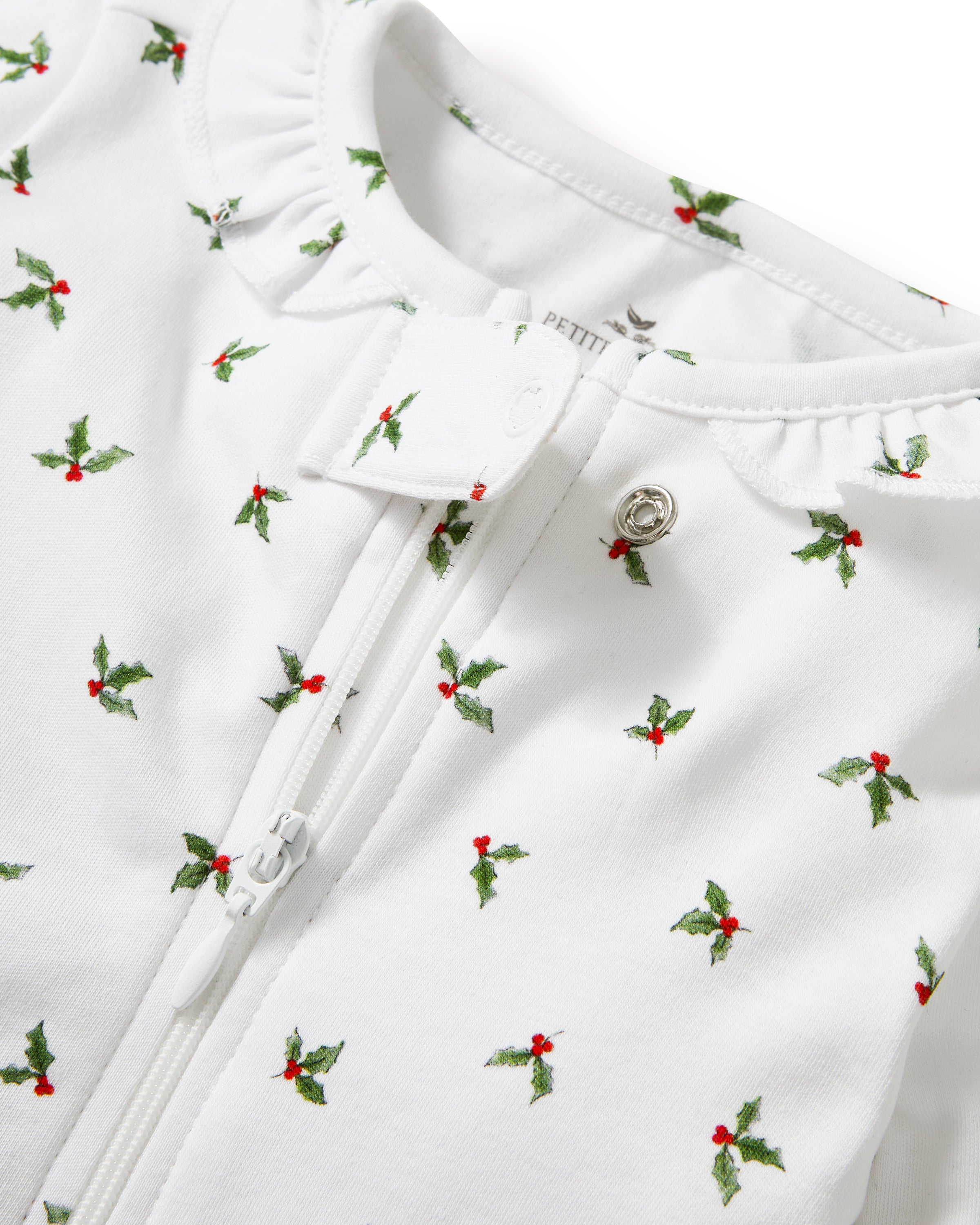Baby's Pima Ruffle Collar Romper in Mistletoe Moments: White footed pajamas with long sleeves, an allover green and red holly print, snap buttons down the front and legs, and an elegant ruffle collar for easy changing and festive style.