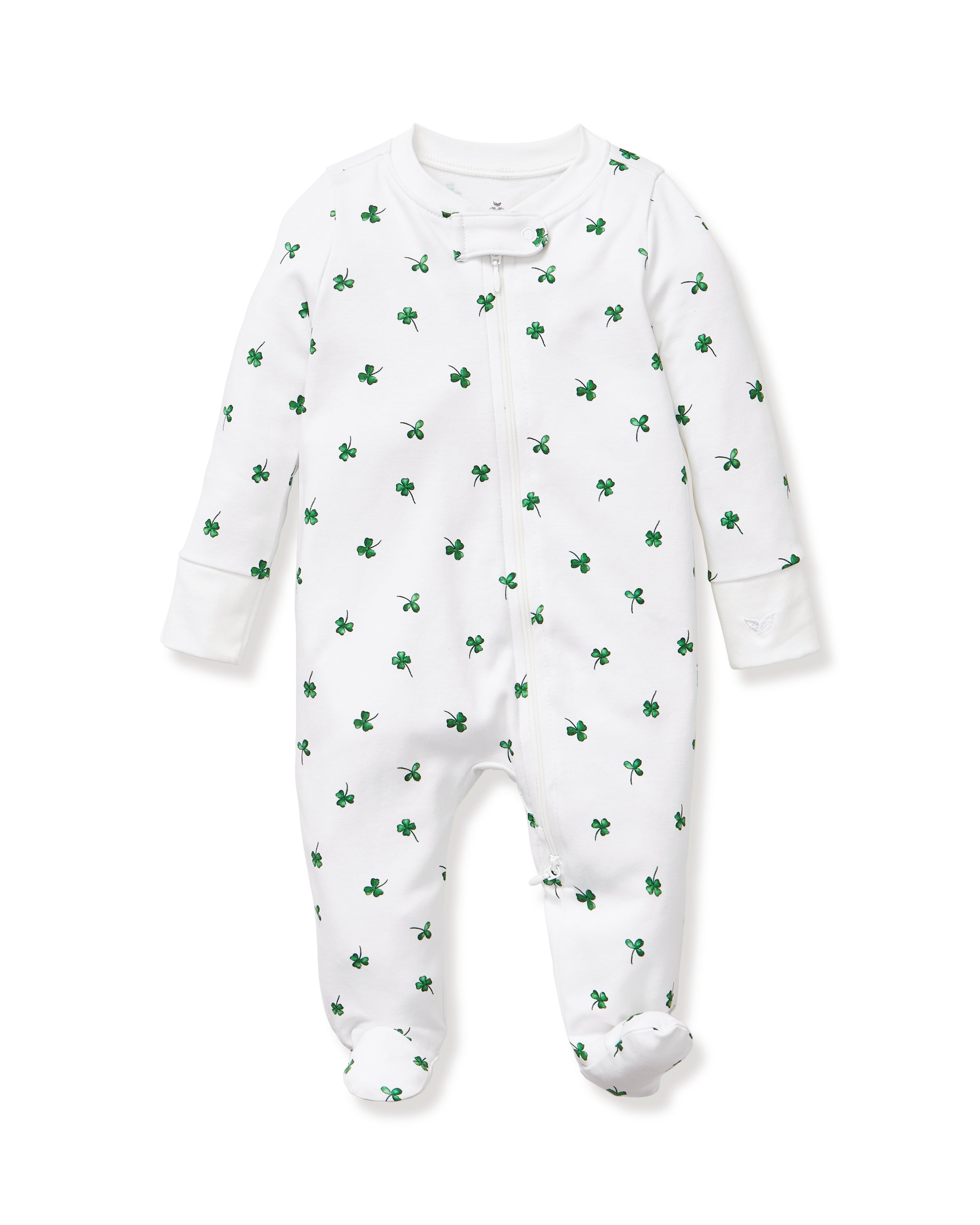 The Baby's Pima Romper in Shamrocks is a white footed onesie with long sleeves, featuring a pattern of small green clovers and a front zipper from neckline to leg.