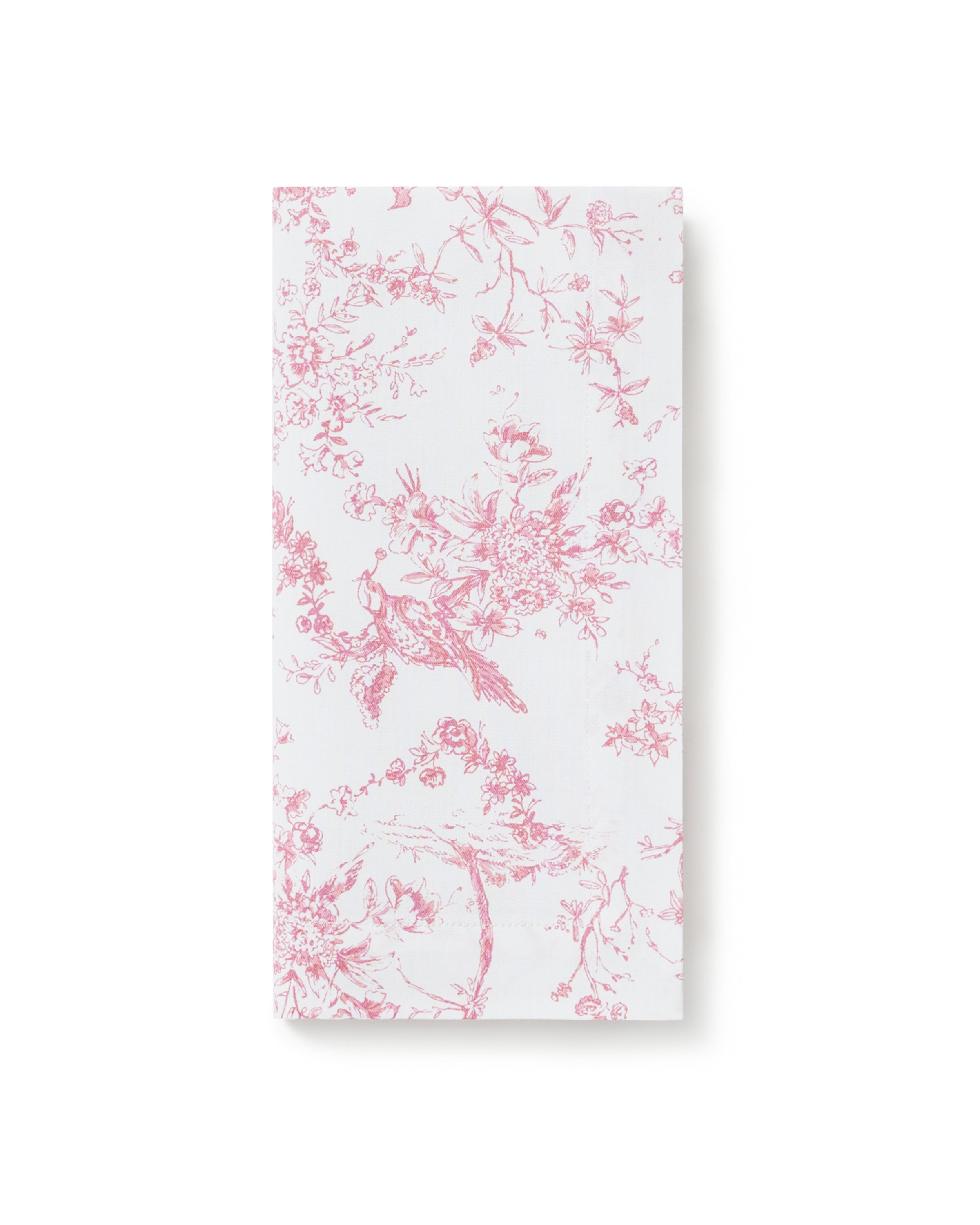 A neatly folded stack of Signature Twill Napkins in Pink Timeless Toile, featuring a delicate pink floral and branch pattern, displayed on a plain white background.