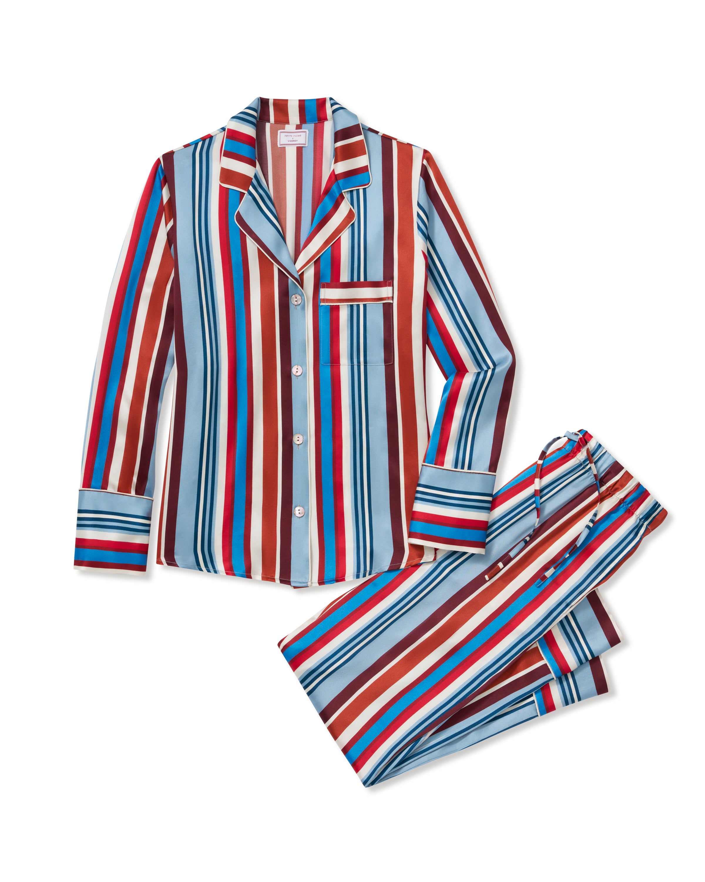 The Women's Silk Pajama Set in Discovery Stripe features long-sleeve, button-up top and matching pants with bold red, blue, brown, and white vertical stripes on smooth silk, displayed on a white background.