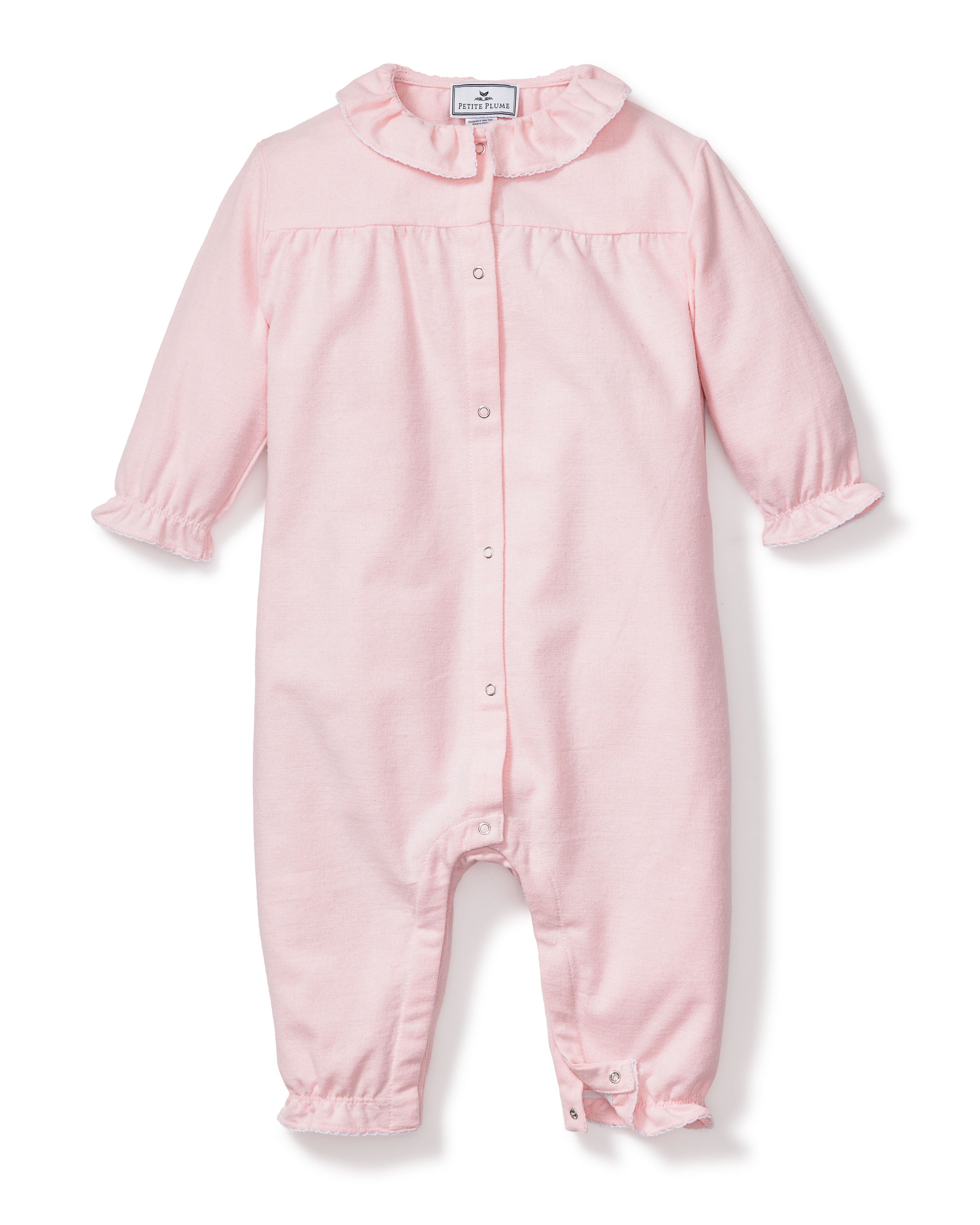 The Babys Flannel Madeline Romper in Pink by Petite Plume is a light pink baby romper made of brushed cotton flannel with long sleeves, ruffled cuffs and collar, plus snap buttons down the front. The soft and cozy fabric makes it perfect for childrens sleepwear.