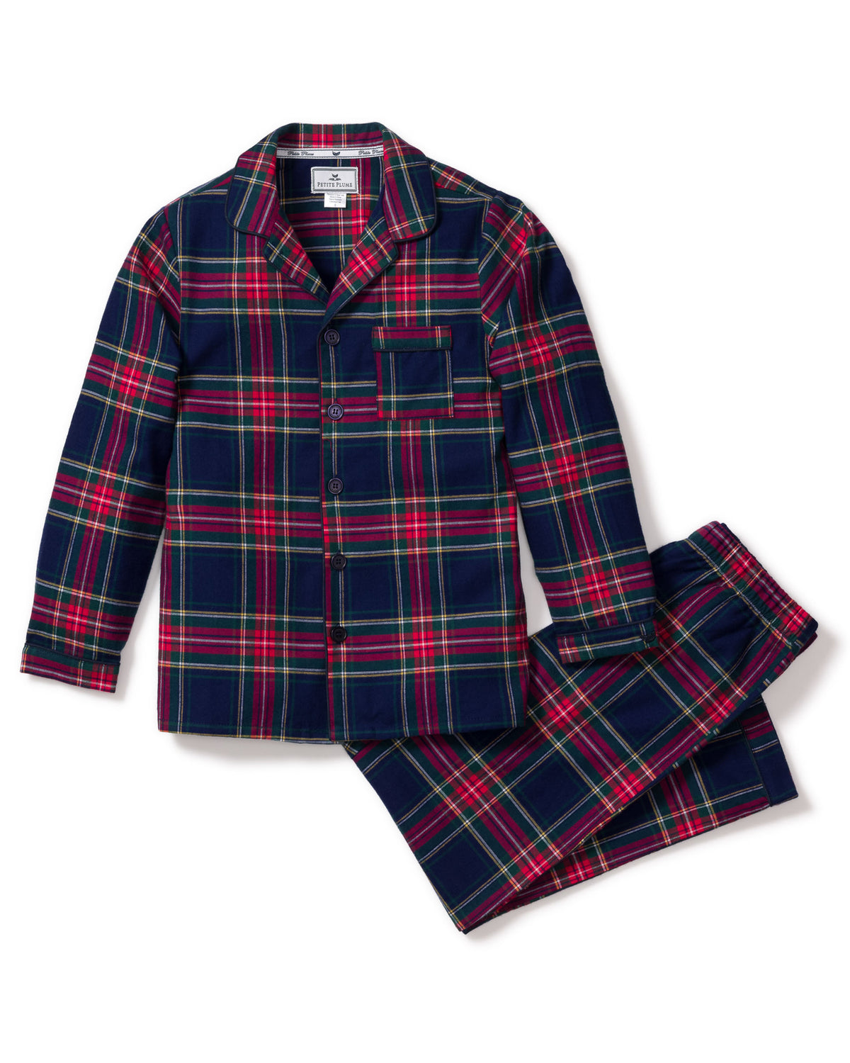 The Kid’s Brushed Twill Pajama Set in Windsor Tartan features a classic button-up long-sleeve top with a chest pocket and matching pants, adorned with a red, green, and navy blue plaid pattern.