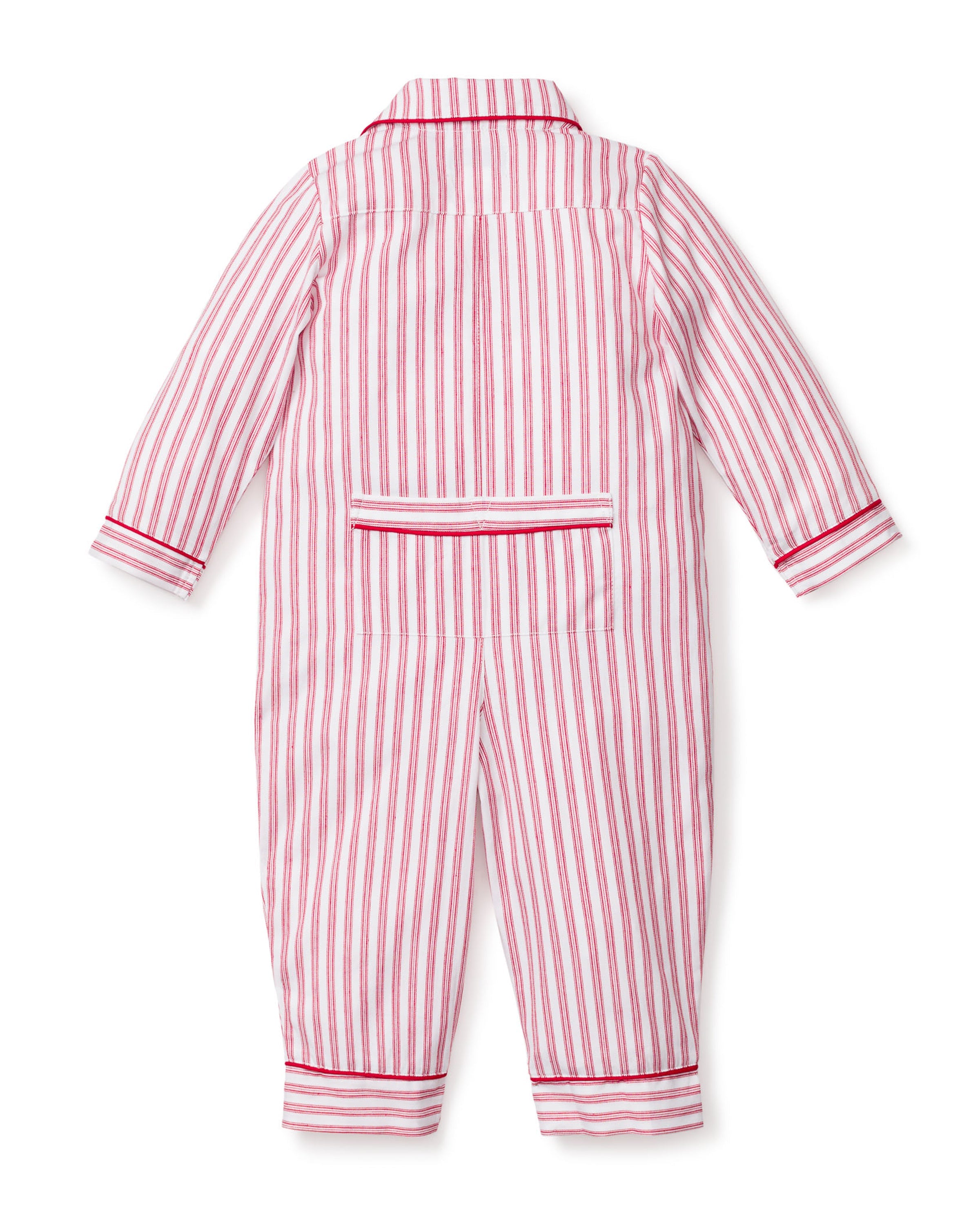 The Babys Twill Romper in Antique Red Ticking by Petite Plume is a childs long-sleeve jumpsuit with vertical red and white stripes, made from lightweight brushed twill. It features a collar, red trim on the cuffs and ankles, and a back flap pocket.
