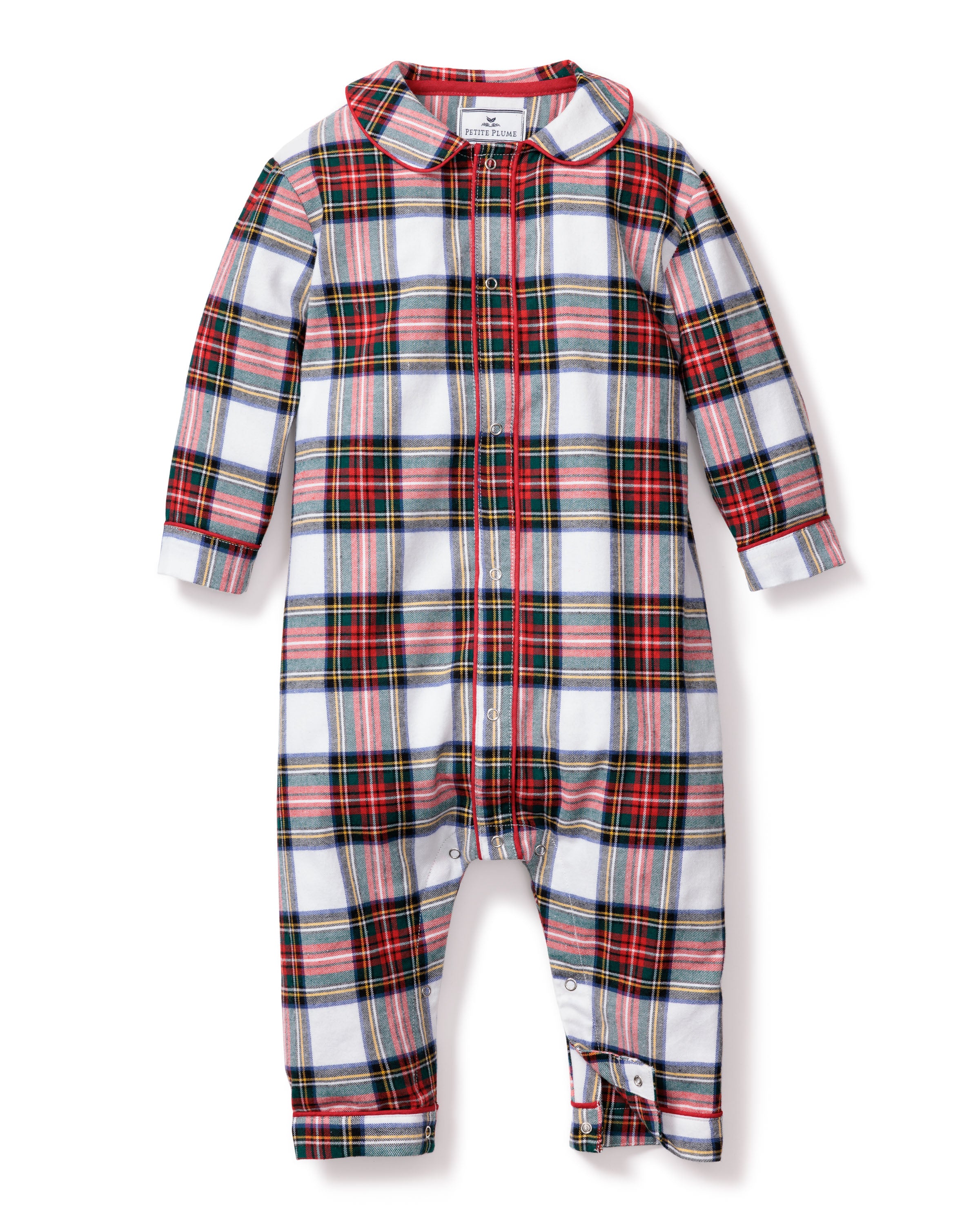The Petite Plume Babys Brushed Cotton Cambridge Romper in Balmoral Tartan features a Scottish-inspired red, green, and black plaid on white. This yarn-dyed cotton romper offers long sleeves, a button-up front, and leg snap closures for easy changing.