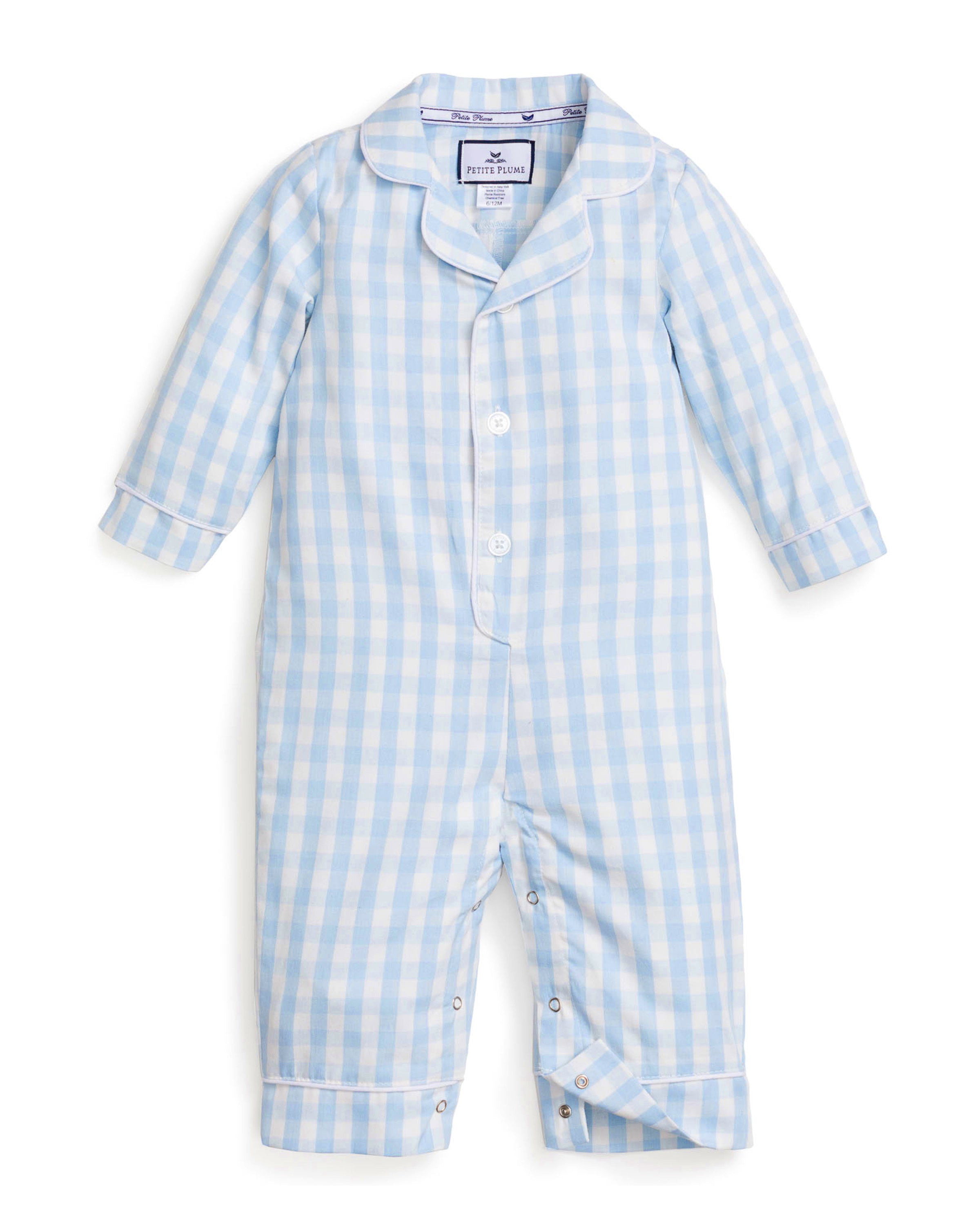 The Baby's Twill Classic Romper in Light Blue Gingham features long sleeves, full-length design, a collar, white front buttons, and snap closures along the legs in a light blue and white gingham pattern.