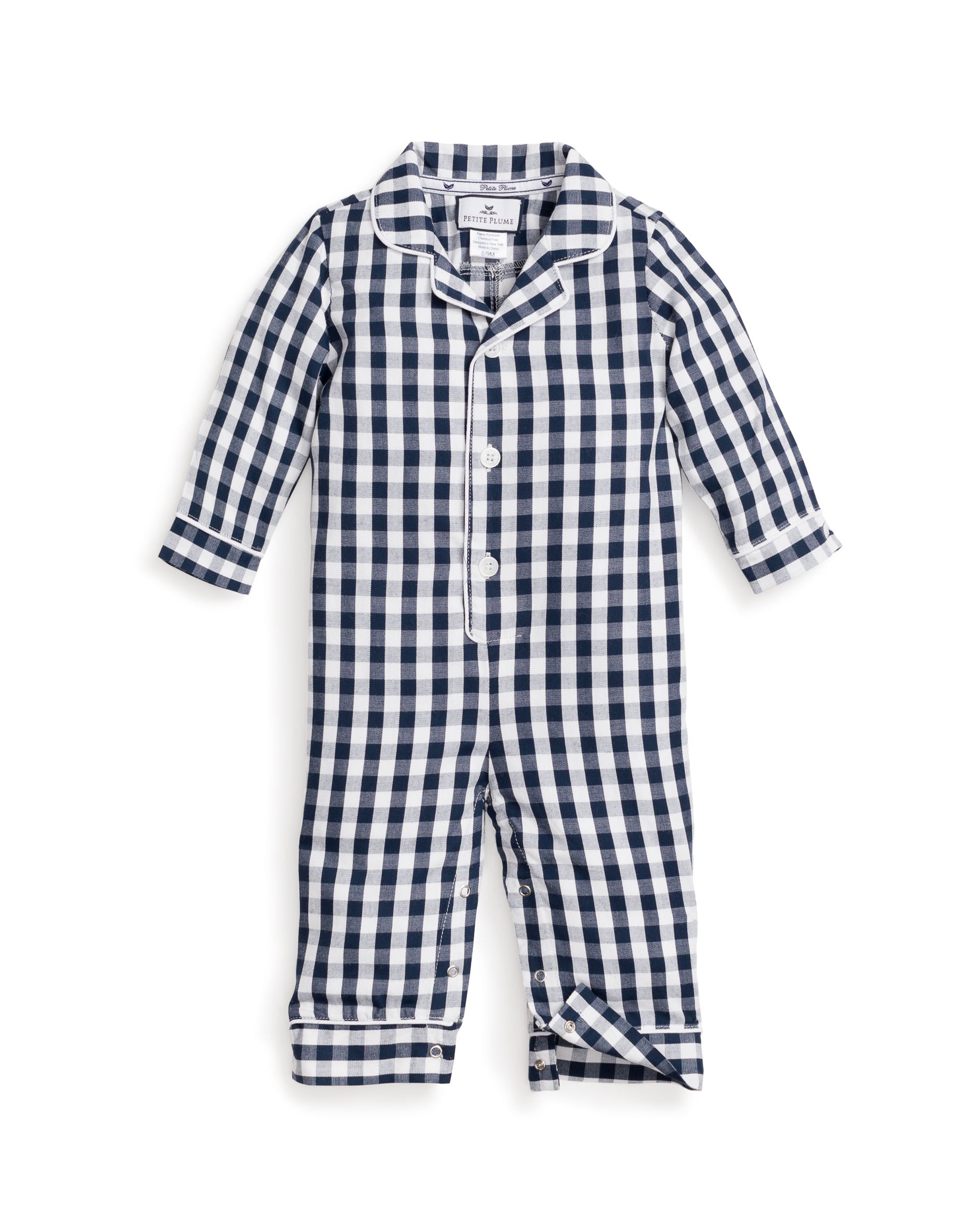 The Babys Twill Winter Romper in Navy Gingham by Petite Plume is a charming romper with long sleeves and button-up front, made from soft, yarn-dyed cotton for lasting color.