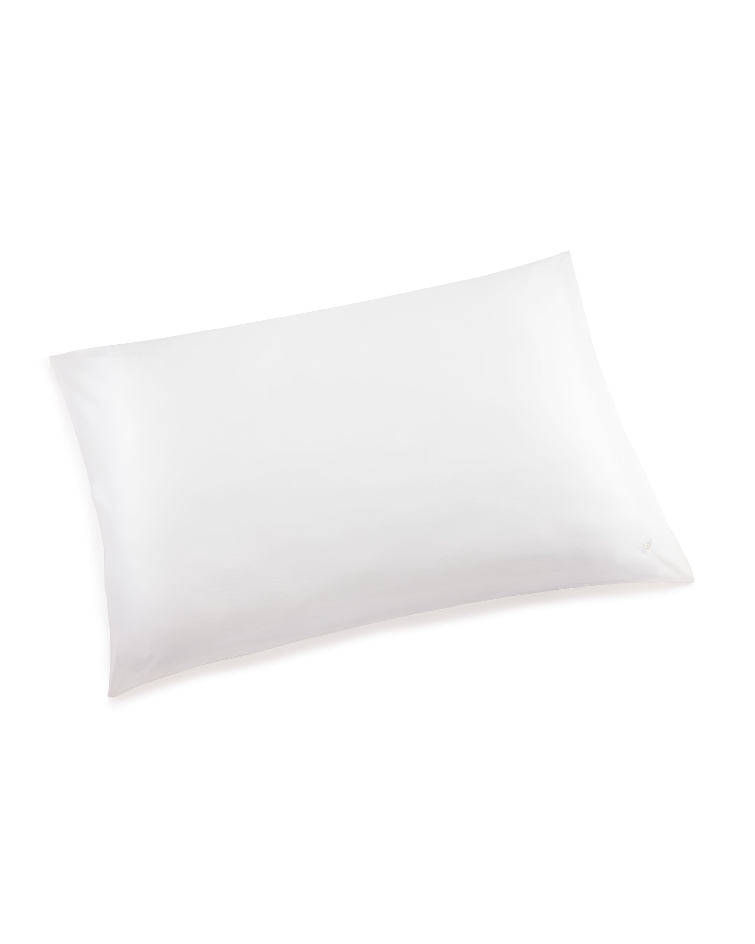 The Silk Pillow Cover in White by Petite Plume is displayed against a white background. Made from luxurious pure silk, it appears soft and smooth with shadows hinting at its three-dimensional shape.
