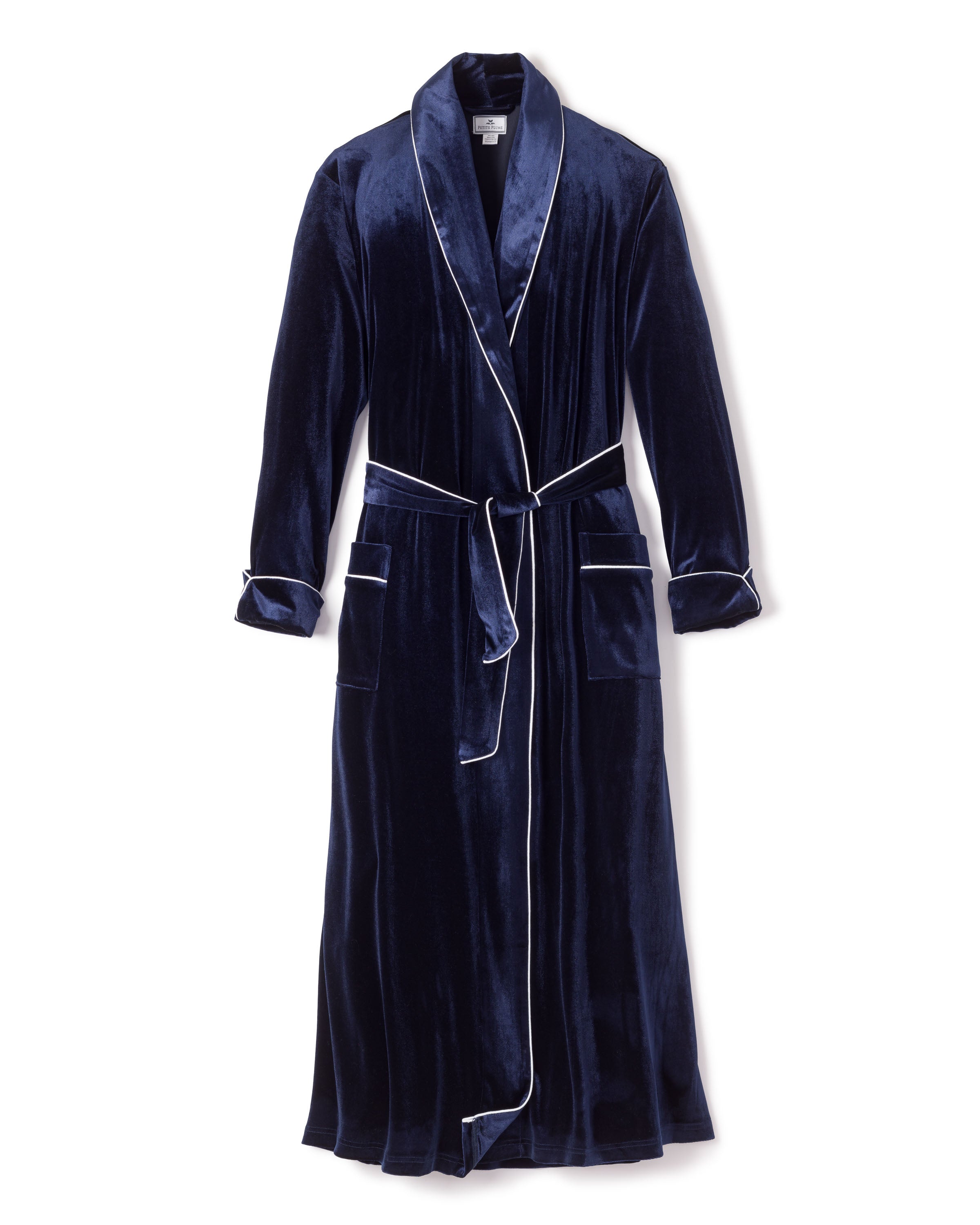 Part of the Cabaret Collection, the Womens Velour Robe in Navy by Petite Plume showcases Hollywood style with its shawl collar, white piping, tied waist belt, large front pockets, and folded cuffs. The luxurious fabric offers an elegant and exquisite sleepwear experience.