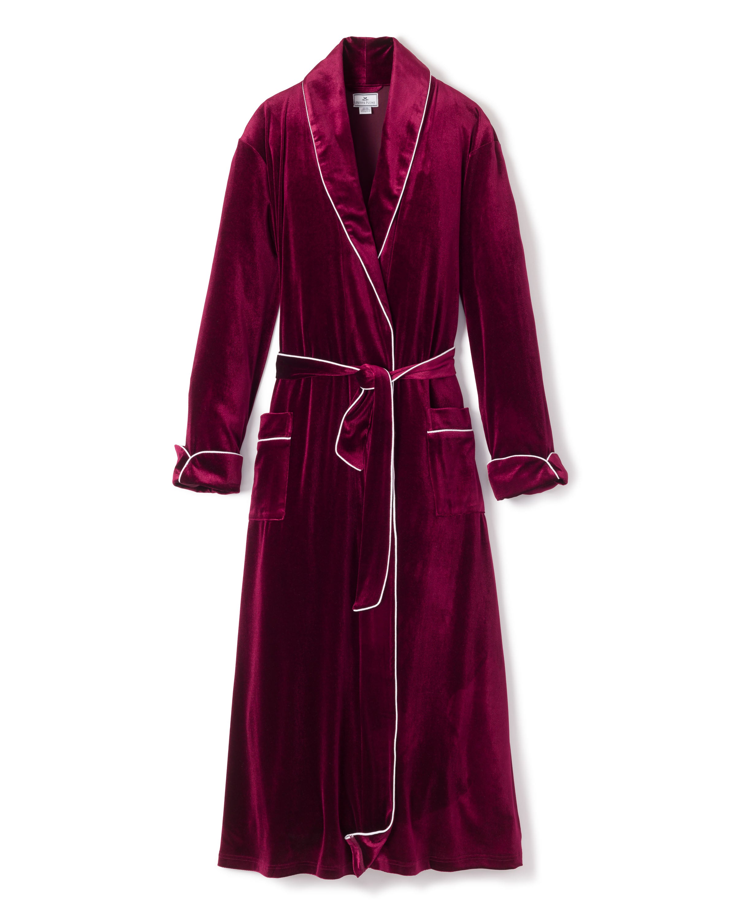 The Petite Plume Womens Velour Robe in Royal Garnet from the Cabaret Collection has white piping, a shawl collar, two front pockets, and a matching belt. This exquisite sleepwear piece is shown on a white background.