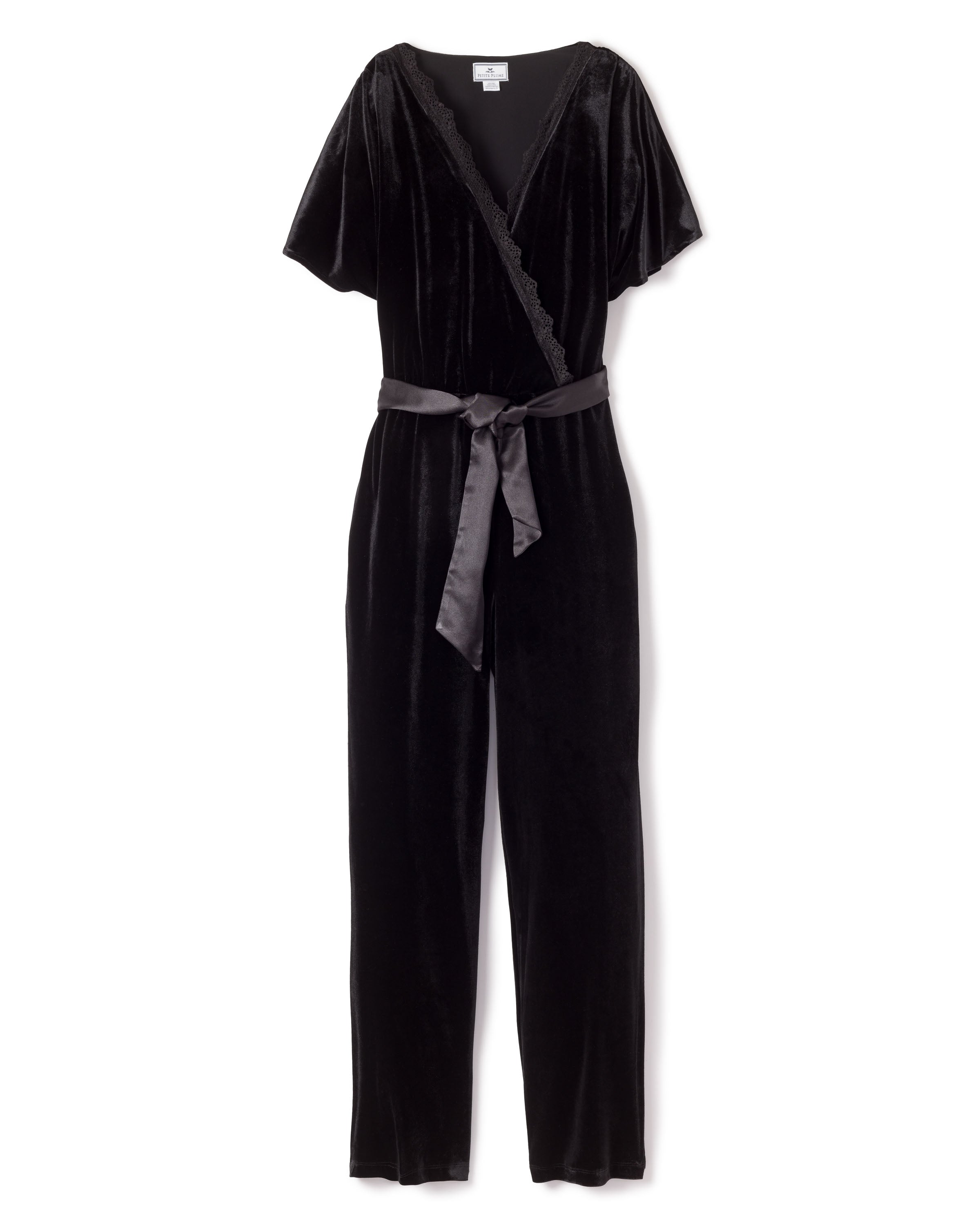 The Womens Velour Jumpsuit in Black by Petite Plume captures classic Hollywood elegance with its V-neck wrap design, short sleeves, and fabric waist belt.