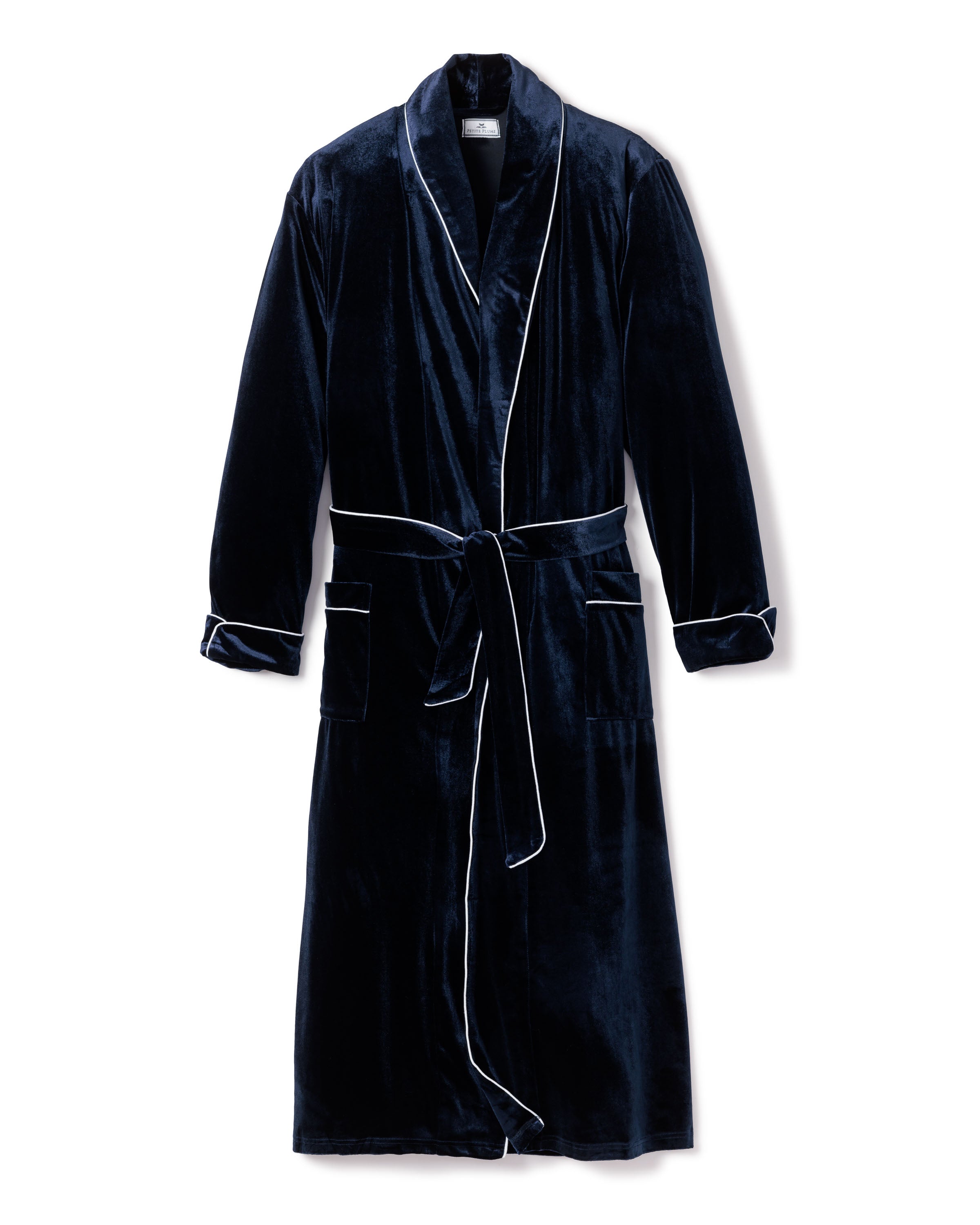 Part of the Cabaret Collection, the Mens Velour Robe in Navy by Petite Plume exudes classic Hollywood style with white piping, a shawl collar, and long sleeves. Featuring two front pockets and a matching belt at the waist, this robe is elegantly showcased on a plain white background.