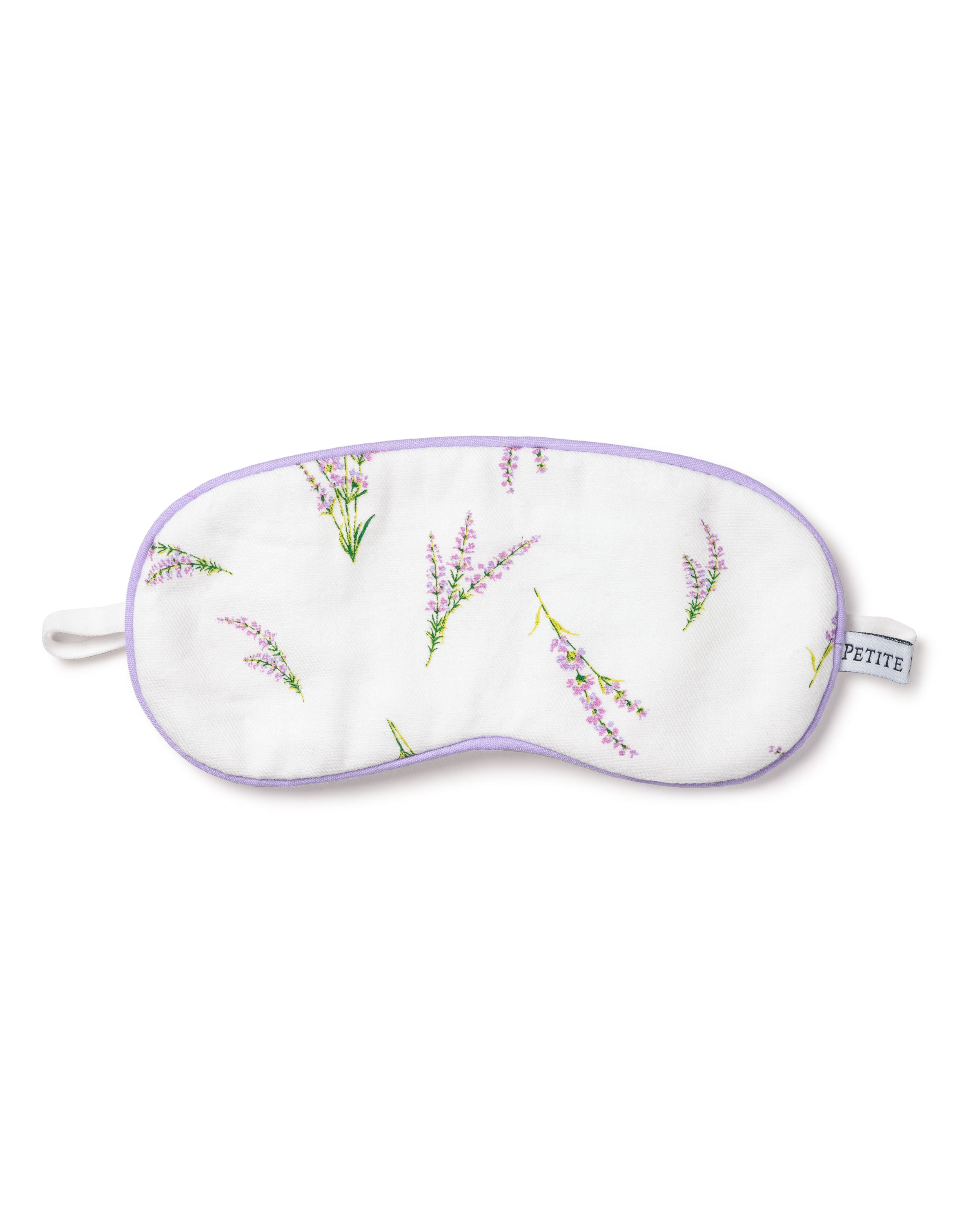 The Kids Sleep Mask in Fields of Provence by Petite Plume offers a luxurious sleep experience with its elegant purple floral design, light purple trim, elastic strap, and subtle side label. Ideal for monogramming, it makes the perfect gift.