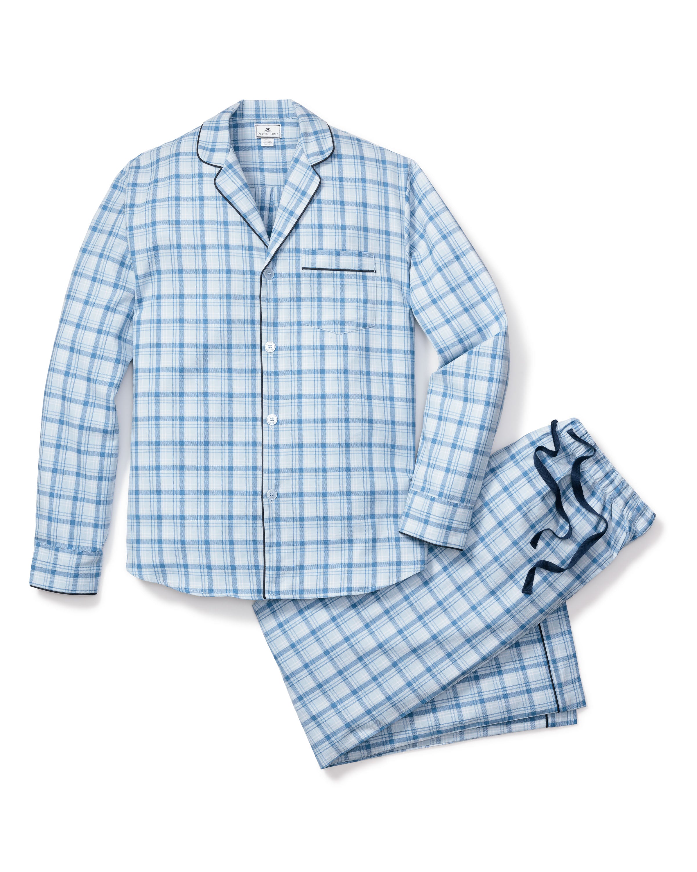 Experience unmatched comfort with the Mens Twill Pajama Set in Seafarer Tartan by Petite Plume. This blue and white plaid set features a long-sleeve button-up shirt with a chest pocket and matching drawstring pants, exuding the timeless charm of the Scottish Highlands.