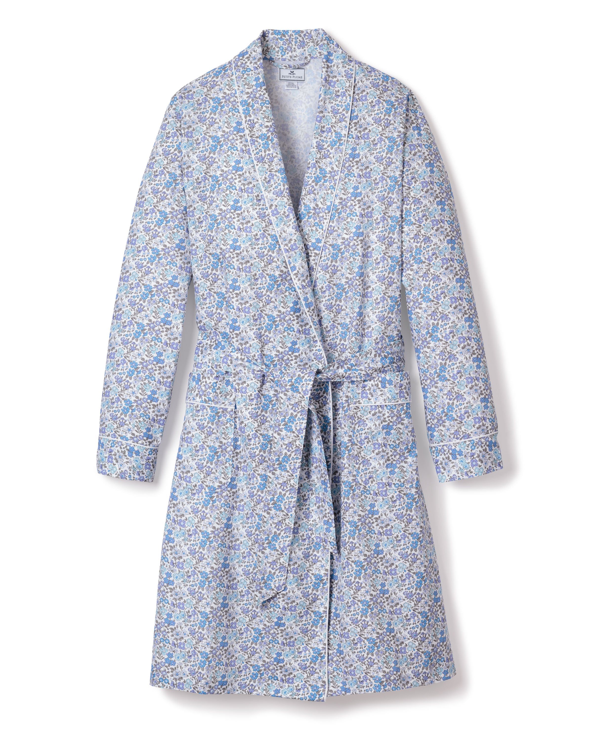 The Womens Twill Robe in Fleur DAzur by Petite Plume showcases a vintage-inspired blue and white floral design, featuring long sleeves, a shawl collar, and a waist belt.