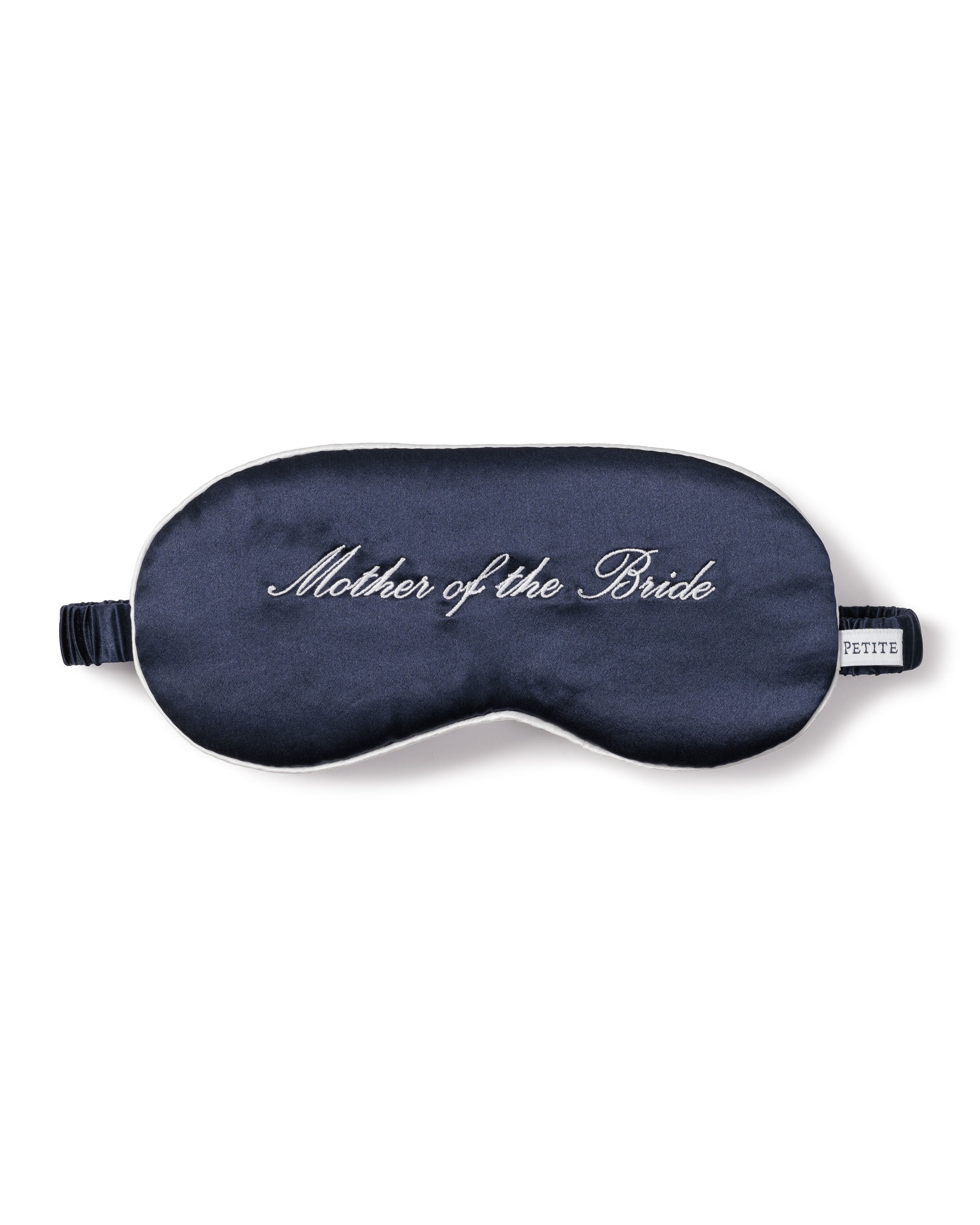 The Petite Plume Womens Silk Mother of the Bride Sleep Mask in dark blue features white embroidery, an adjustable elastic strap, and a side tag—making it a perfect wedding gift.