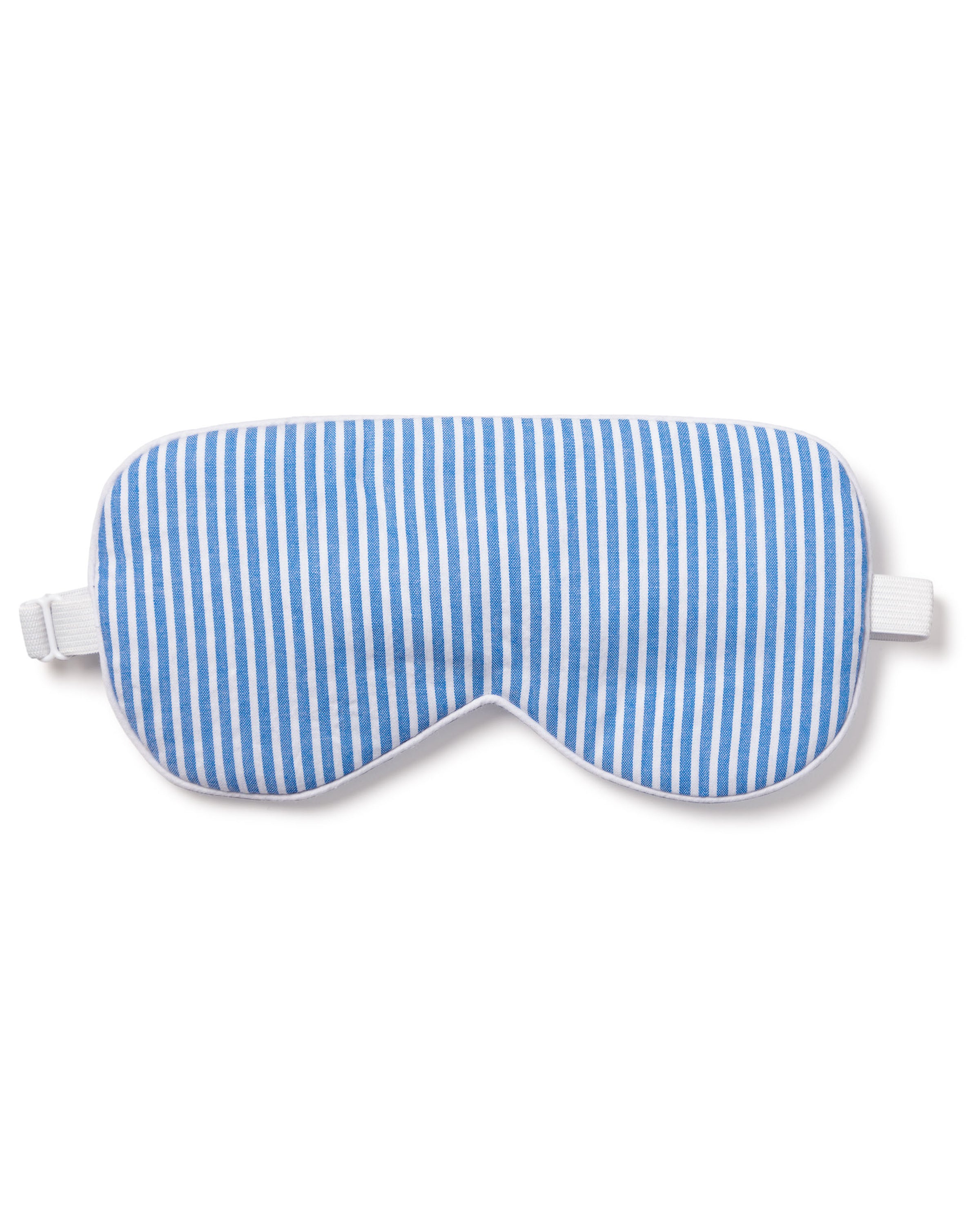 The Adults Sleep Mask in French Blue Seersucker by Petite Plume, featuring a blue and white stripe design with an elastic strap, makes the perfect gift. Pair it with matching eye masks for a thoughtful present.