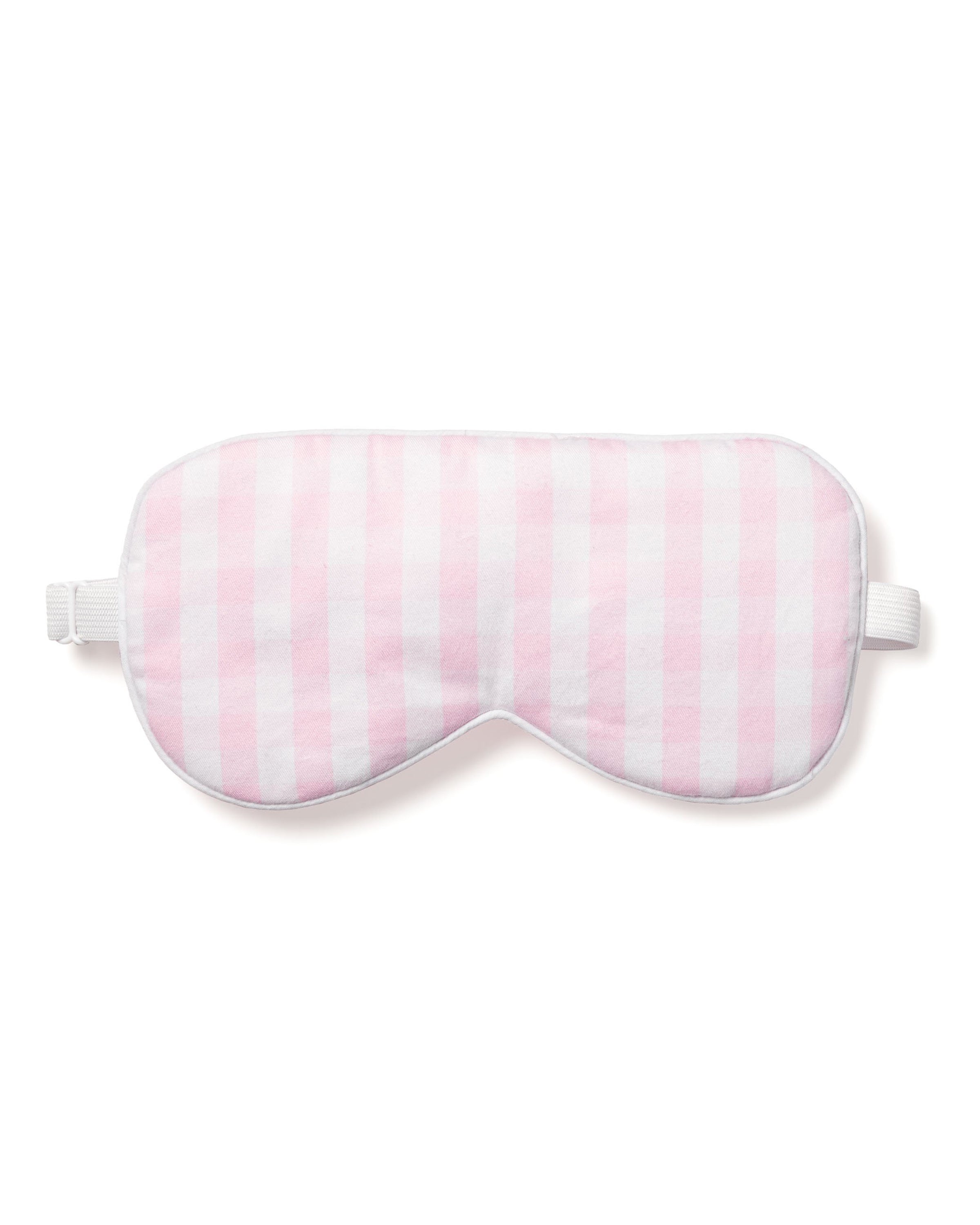 The Adults Twill Sleep Mask in Pink Gingham by Petite Plume, featuring an elastic strap to block out light, is a perfect gift. Customize it with monogramming for personalization or pair it with matching masks for you and a friend.