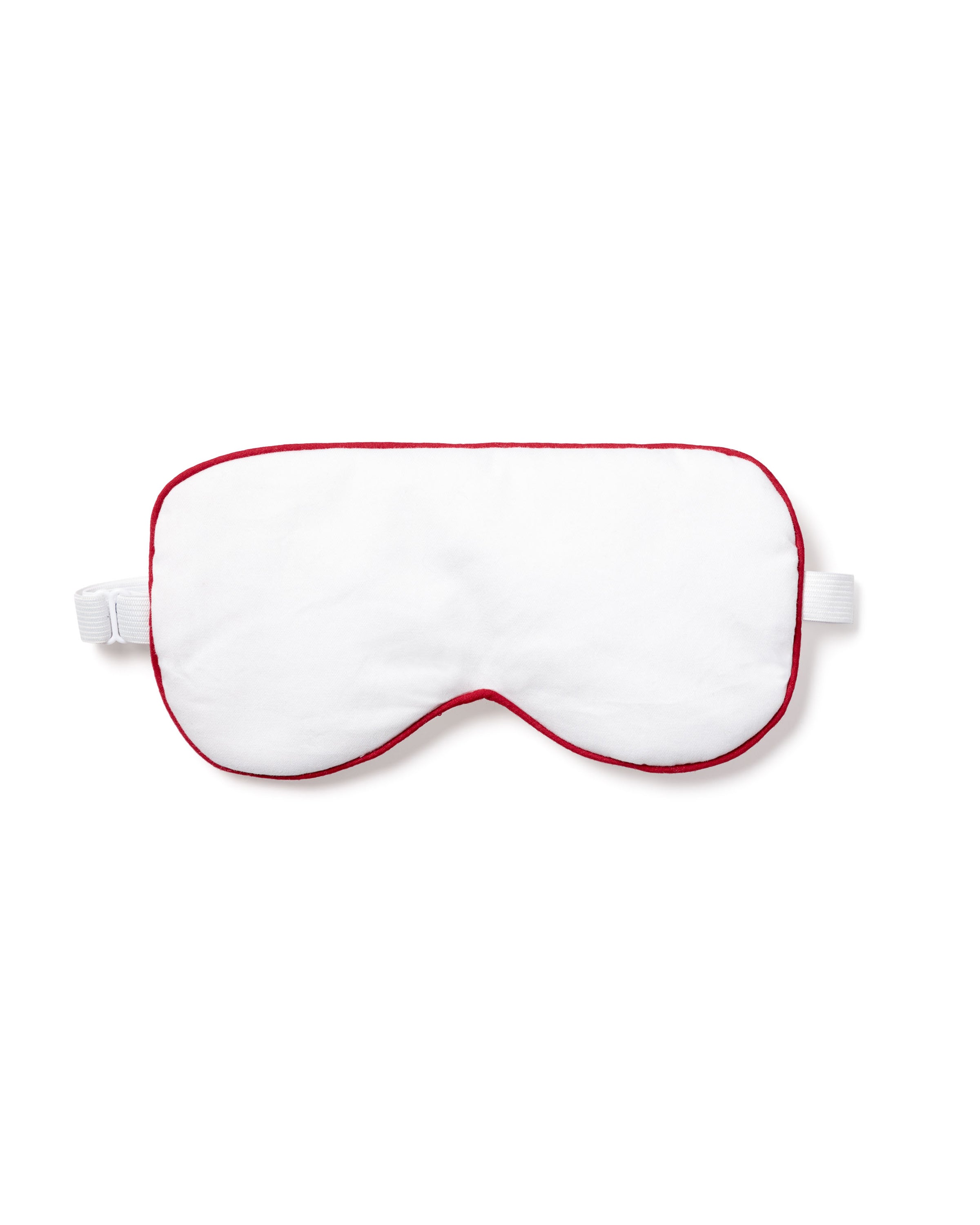 The Petite Plume Adults Twill Sleep Mask in White with Red Piping, elegantly displayed on a white background, features an elastic strap. Its perfect for those looking for matching eye masks or a special monogrammed gift.