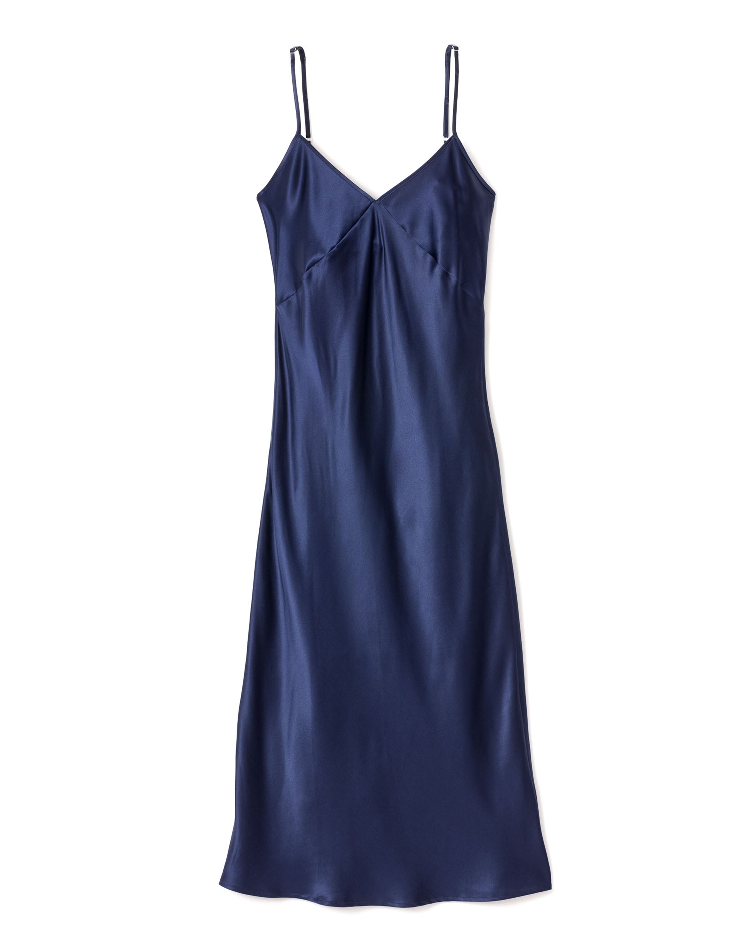 The Womens Silk Cosette Nightgown in Navy by Petite Plume is a sleeveless, elegant mulberry silk nightdress with a V-neckline and thin spaghetti straps, boasting a smooth, shiny texture perfect for luxury sleepwear.