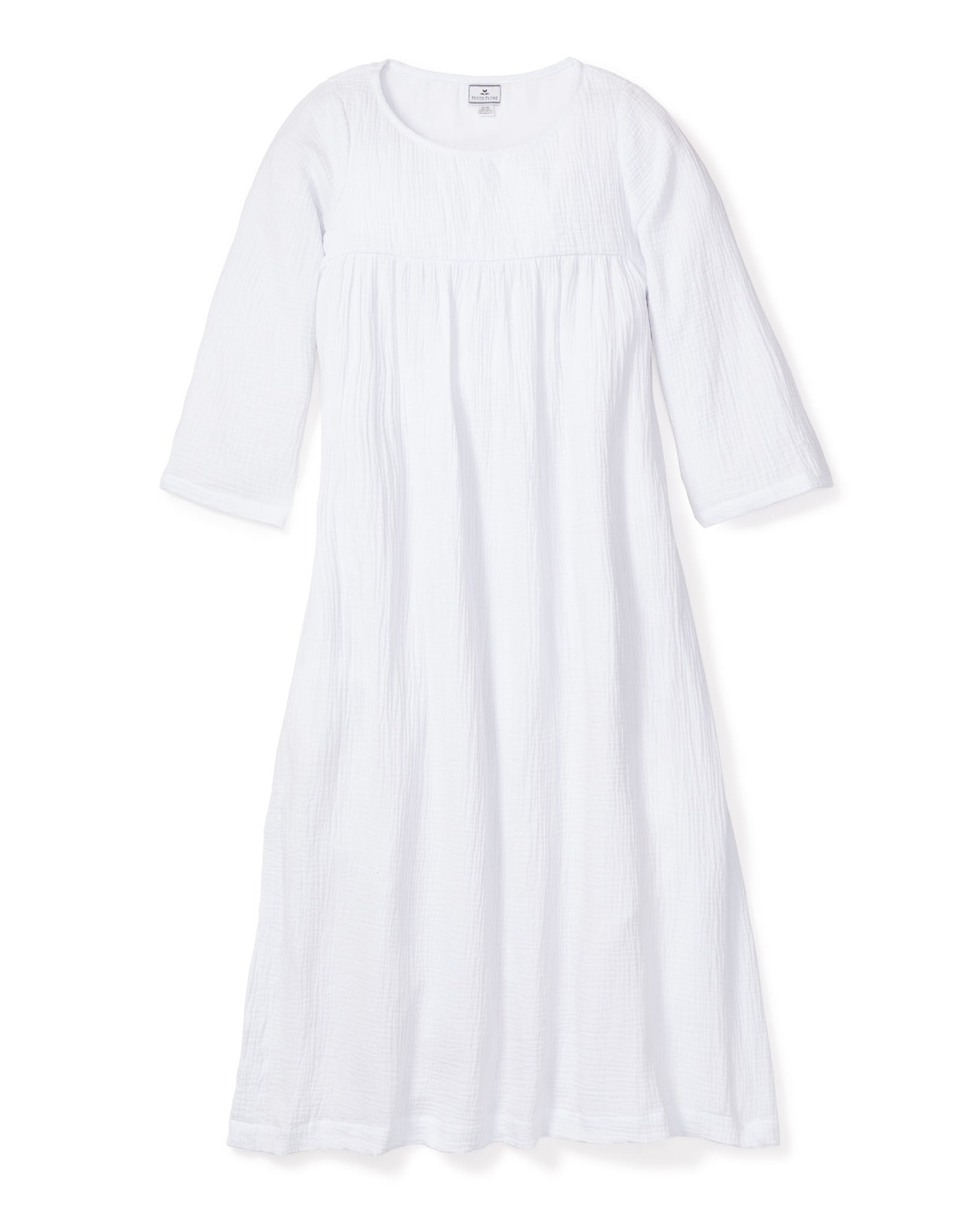 Discover the Womens Gauze Provence Sundress in White by Petite Plume, featuring long sleeves and a round neckline. Crafted from lightweight cotton gauze, this loose-fitting gown is perfect for restful nights with its simple and comfortable design.