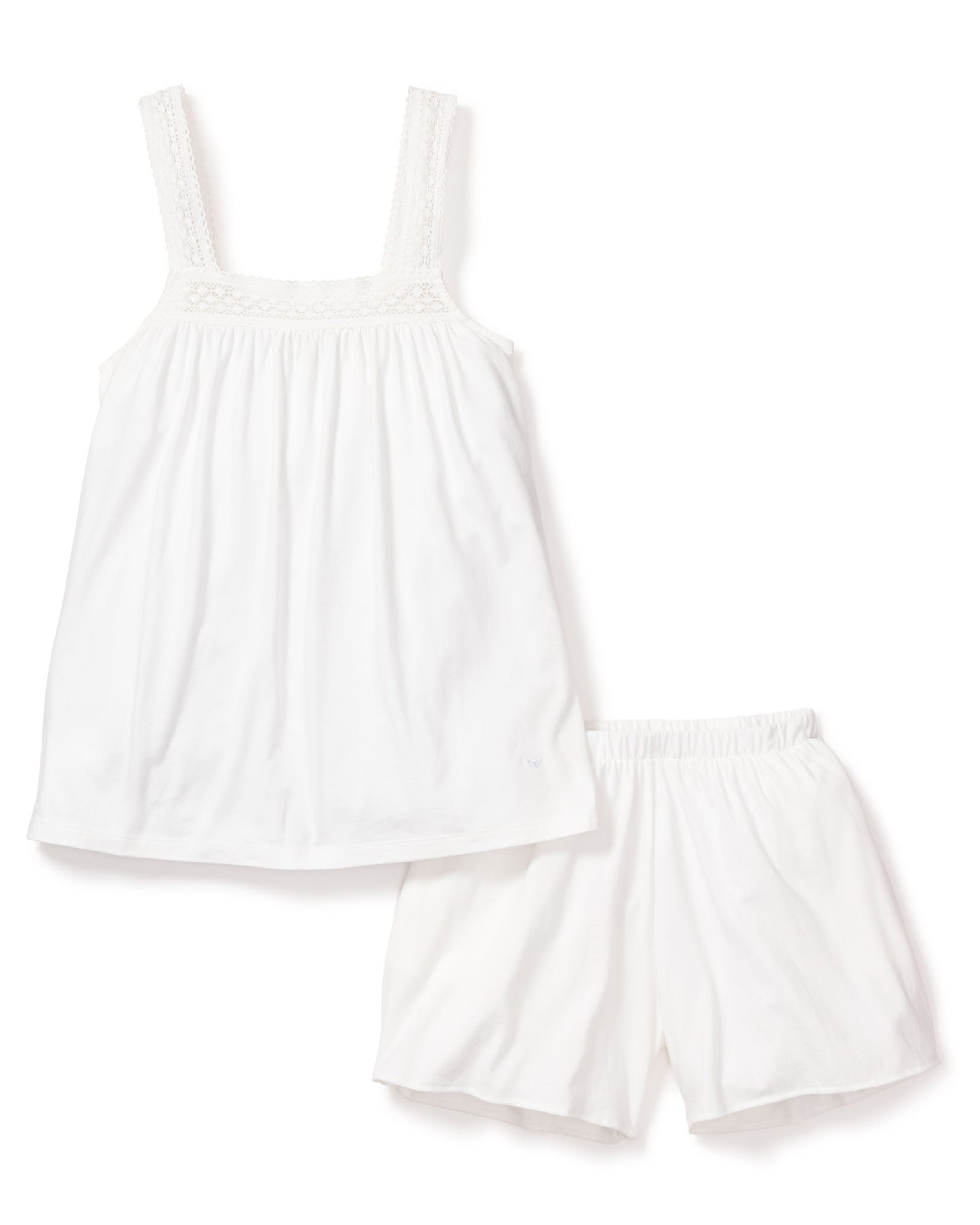 The Petite Plume Womens Pima Camille Short Set in White includes a sleeveless top with lace-trimmed straps and matching shorts, both crafted from luxurious Peruvian Pima cotton for comfort. Featuring an elastic waistband, the ensemble offers a loose, flowy fit on a crisp white background.