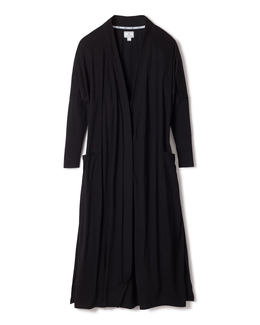The Womens Pima Duster in Black by Petite Plume is a black, long-sleeved open-front cardigan made from soft Peruvian Pima cotton, featuring a draped design and two large front pockets, set against a plain white background.